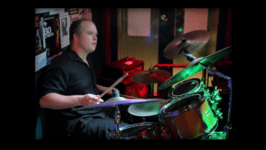 mixing and mastering engineer Daniel Booth playing a Yamaha 9000 recording custom drumset